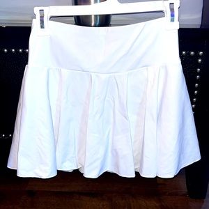 Never worn perfect condition HALARA tennis set with never opened pasties.